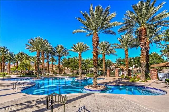 11573 Glowing Sunset Ln, Las Vegas, NV 89135 - community pool with a patio area