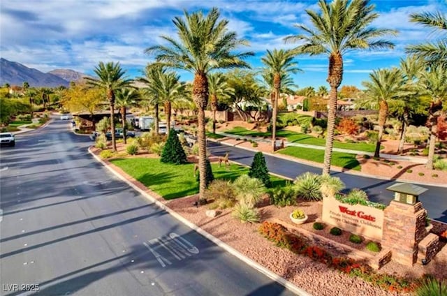 11573 Glowing Sunset Ln, Las Vegas, NV 89135 - view of asphalt road with a mountain view and curbs