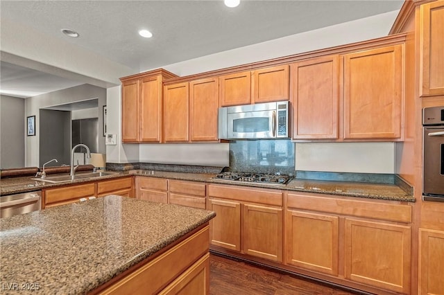 2244 Manosque Ln, Henderson, NV 89044 - kitchen featuring a sink, appliances with stainless steel finishes, and dark stone counters