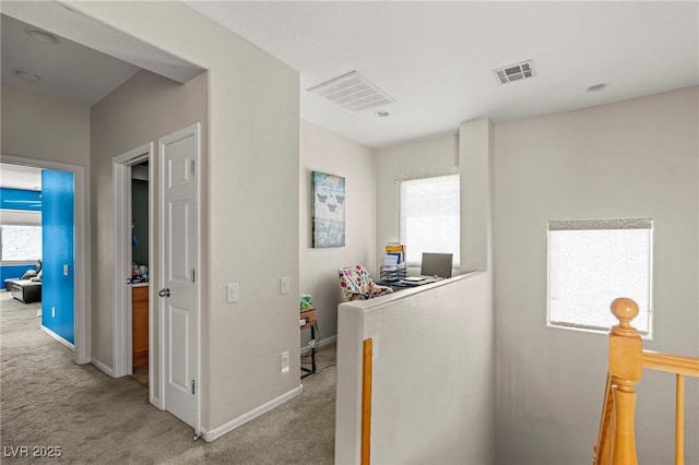 2244 Manosque Ln, Henderson, NV 89044 - hallway featuring an upstairs landing, visible vents, light colored carpet, and baseboards