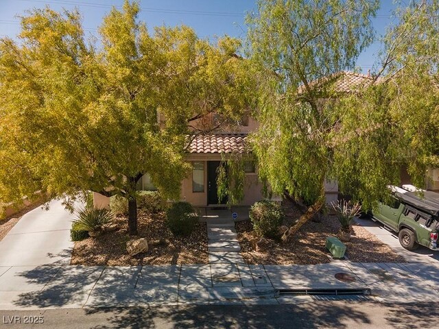 2244 Manosque Ln, Henderson, NV 89044 - obstructed view of property with stucco siding and a tile roof