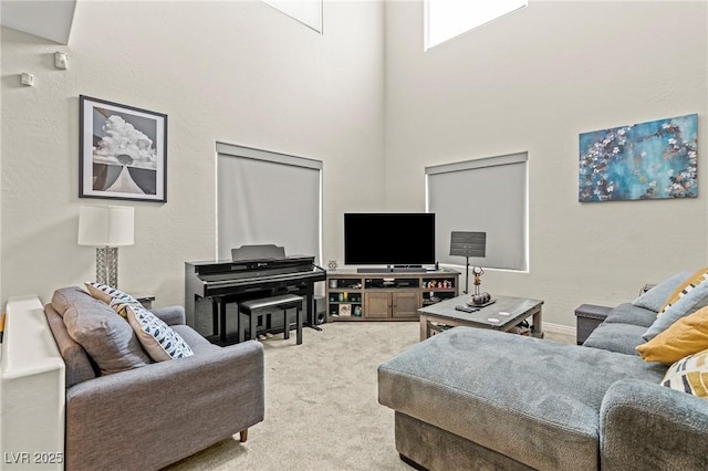 2244 Manosque Ln, Henderson, NV 89044 - living room featuring a high ceiling and light carpet