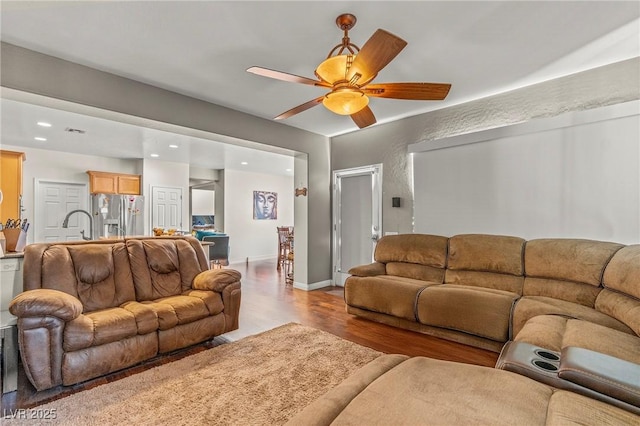 2244 Manosque Ln, Henderson, NV 89044 - living area featuring light wood-type flooring, a ceiling fan, and recessed lighting