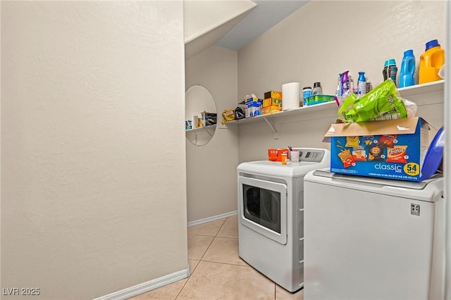 2244 Manosque Ln, Henderson, NV 89044 - laundry area featuring baseboards, washer and clothes dryer, laundry area, and light tile patterned flooring
