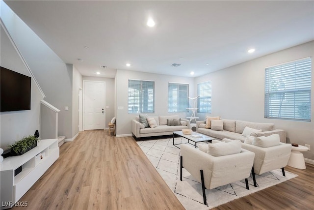 3525 Serravalle Ln, Henderson, NV 89044 - living area featuring light wood finished floors, recessed lighting, baseboards, and stairway