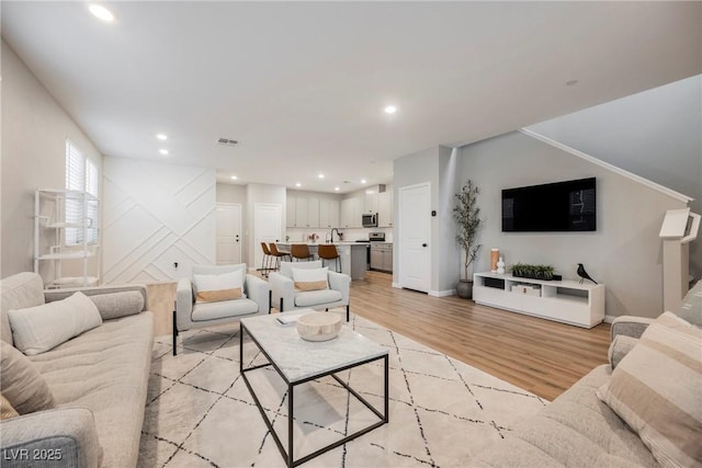 3525 Serravalle Ln, Henderson, NV 89044 - living area with light wood-style flooring, recessed lighting, and baseboards