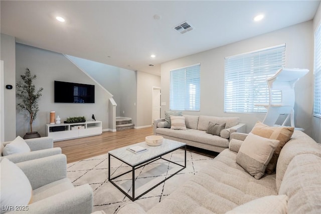 3525 Serravalle Ln, Henderson, NV 89044 - living room featuring stairway, wood finished floors, plenty of natural light, recessed lighting, and baseboards