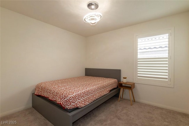 carpeted bedroom with baseboards