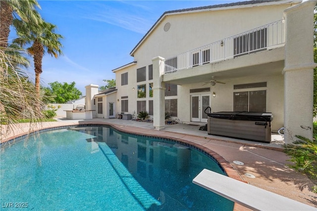 7460 Grassy Field Ct, Las Vegas, NV 89131 - view of swimming pool featuring a hot tub, french doors, a ceiling fan, a patio, and a diving board