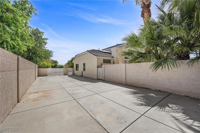 7460 Grassy Field Ct, Las Vegas, NV 89131 - fenced backyard featuring a patio area