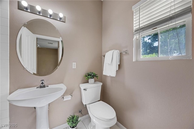 7460 Grassy Field Ct, Las Vegas, NV 89131 - bathroom featuring toilet and baseboards