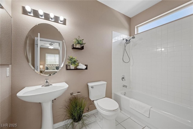 7460 Grassy Field Ct, Las Vegas, NV 89131 - full bathroom featuring ceiling fan, toilet, shower / bathtub combination, baseboards, and tile patterned floors