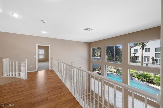 7460 Grassy Field Ct, Las Vegas, NV 89131 - hall featuring an upstairs landing, wood finished floors, baseboards, and recessed lighting