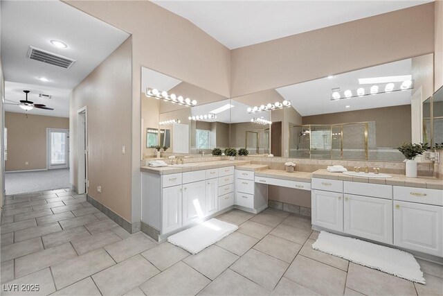 7460 Grassy Field Ct, Las Vegas, NV 89131 - bathroom featuring a stall shower, vanity, tile patterned flooring, and a ceiling fan