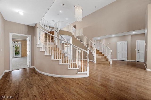 7460 Grassy Field Ct, Las Vegas, NV 89131 - foyer entrance featuring stairs, wood finished floors, baseboards, and a high ceiling