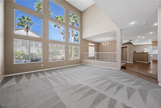 7460 Grassy Field Ct, Las Vegas, NV 89131 - unfurnished living room featuring a chandelier, carpet, baseboards, and recessed lighting