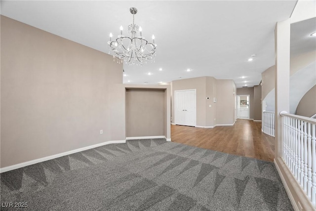 7460 Grassy Field Ct, Las Vegas, NV 89131 - unfurnished room featuring carpet floors, baseboards, a chandelier, recessed lighting, and wood finished floors