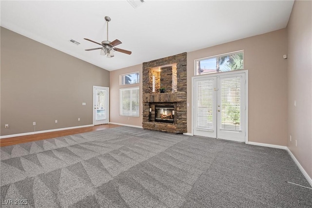 7460 Grassy Field Ct, Las Vegas, NV 89131 - unfurnished living room featuring lofted ceiling, a ceiling fan, carpet flooring, and baseboards