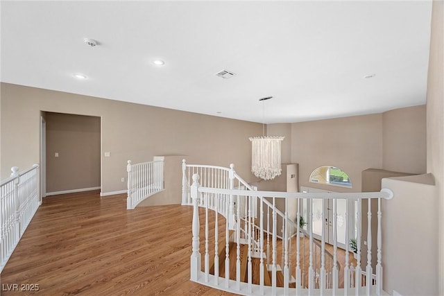 7460 Grassy Field Ct, Las Vegas, NV 89131 - hallway featuring an upstairs landing, wood finished floors, a chandelier, recessed lighting, and baseboards