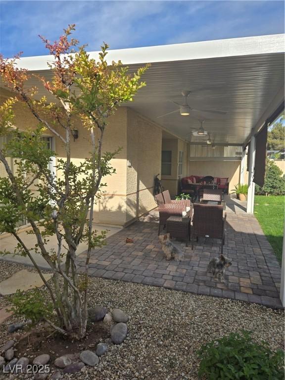 view of patio / terrace featuring an outdoor living space and a ceiling fan