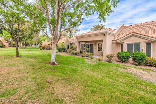 8513 Glenmount Dr, Las Vegas, NV 89134 - view of front facade featuring a front lawn, stucco siding, and a tile roof