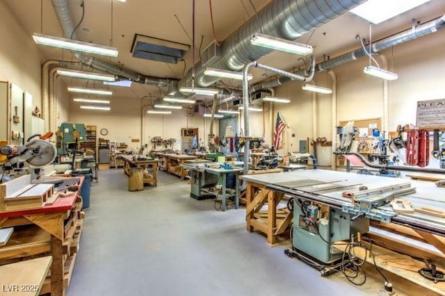8513 Glenmount Dr, Las Vegas, NV 89134 - miscellaneous room with concrete flooring and a workshop area
