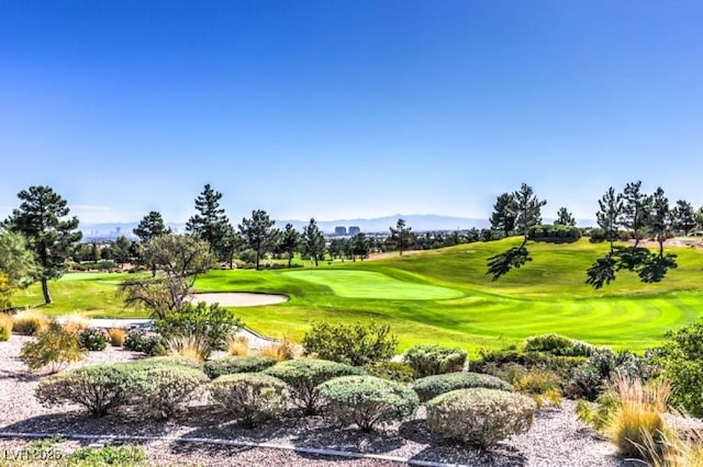 8513 Glenmount Dr, Las Vegas, NV 89134 - view of property's community with a mountain view, view of golf course, and a lawn