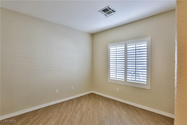 2229 Suffron Hills Ct, Henderson, NV 89044 - unfurnished room featuring visible vents, baseboards, and wood finished floors