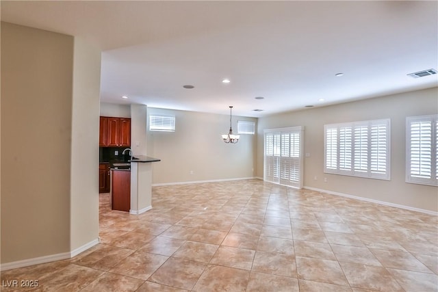 2229 Suffron Hills Ct, Henderson, NV 89044 - unfurnished living room featuring recessed lighting, visible vents, an inviting chandelier, and light tile patterned flooring