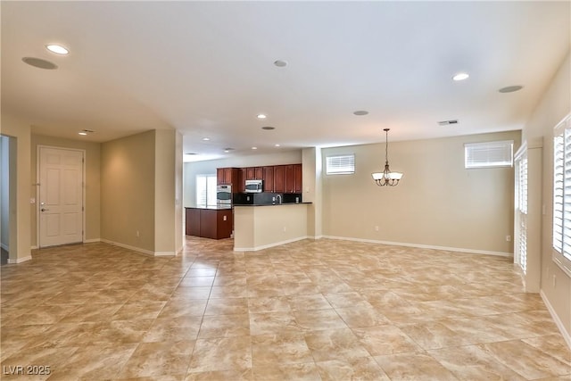 2229 Suffron Hills Ct, Henderson, NV 89044 - unfurnished living room with a chandelier, visible vents, plenty of natural light, and recessed lighting