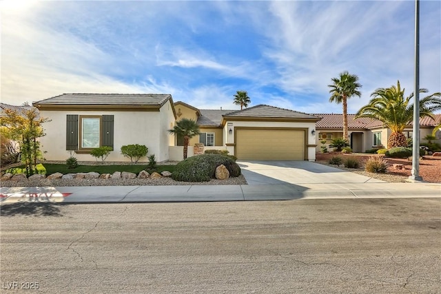 2229 Suffron Hills Ct, Henderson, NV 89044 - ranch-style house featuring a tile roof, stucco siding, a garage, and concrete driveway