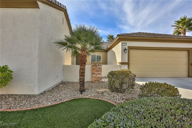 2229 Suffron Hills Ct, Henderson, NV 89044 - exterior space with an attached garage, concrete driveway, and stucco siding