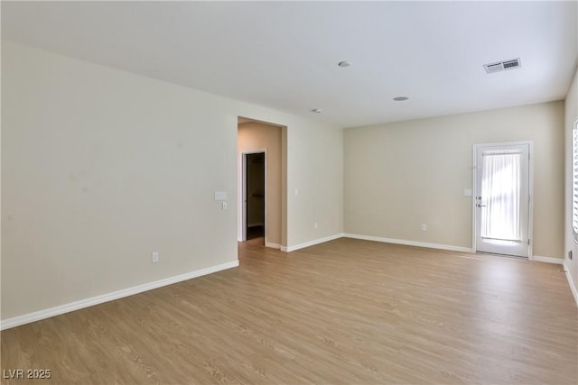2229 Suffron Hills Ct, Henderson, NV 89044 - empty room with light wood finished floors, visible vents, and baseboards