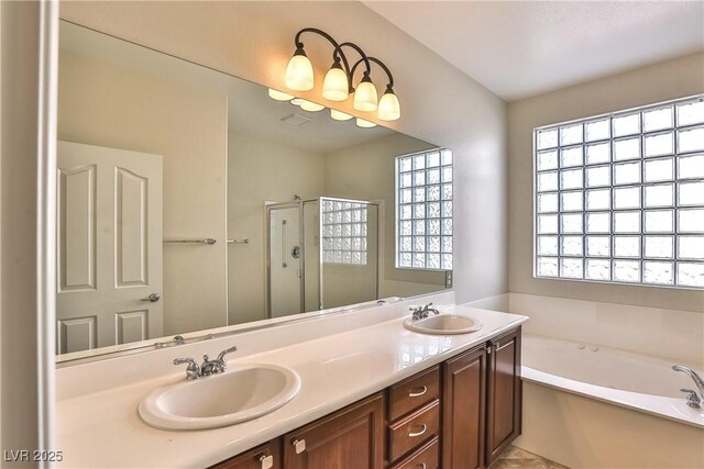 2229 Suffron Hills Ct, Henderson, NV 89044 - bathroom with a bath, a stall shower, double vanity, and a sink