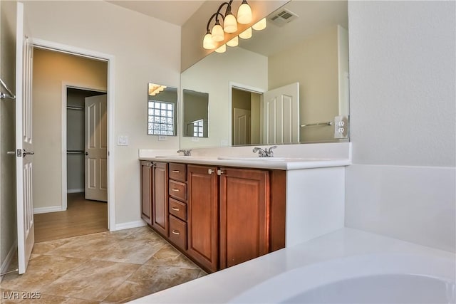 2229 Suffron Hills Ct, Henderson, NV 89044 - full bathroom featuring baseboards, visible vents, a sink, and double vanity