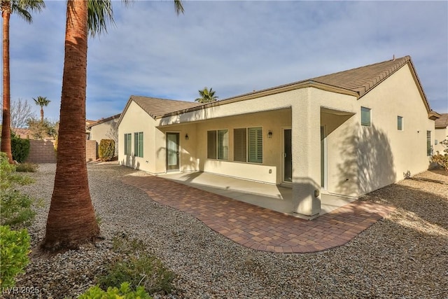 2229 Suffron Hills Ct, Henderson, NV 89044 - rear view of property with a patio area, stucco siding, and fence