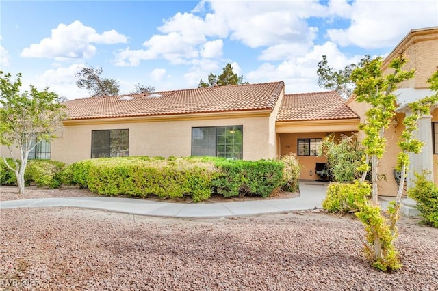 2851 S Valley View Blvd Unit 1098, Las Vegas, NV 89102 - view of front of property with a tile roof and stucco siding