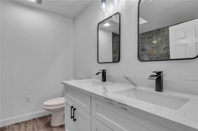 2851 S Valley View Blvd Unit 1098, Las Vegas, NV 89102 - full bath with toilet, double vanity, wood finished floors, and baseboards