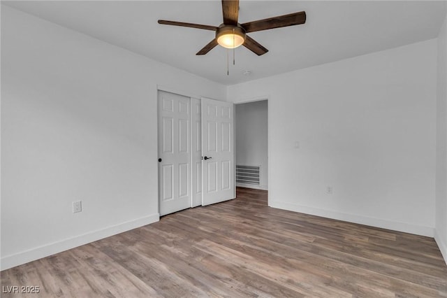 2851 S Valley View Blvd Unit 1098, Las Vegas, NV 89102 - unfurnished bedroom with wood finished floors, baseboards, a closet, and a ceiling fan