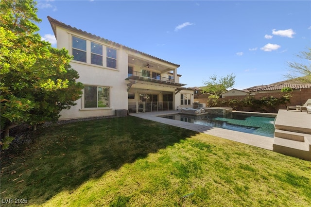 12665 Cooks Bay Ct, Las Vegas, NV 89141 - rear view of property with ceiling fan, a lawn, a fenced backyard, stucco siding, and a balcony