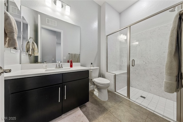 12665 Cooks Bay Ct, Las Vegas, NV 89141 - full bathroom with vanity, tile patterned flooring, visible vents, toilet, and a stall shower