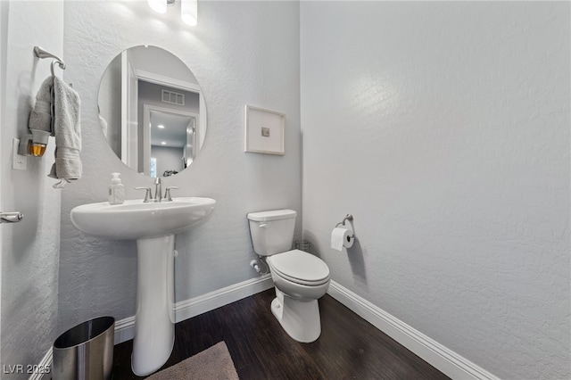 12665 Cooks Bay Ct, Las Vegas, NV 89141 - bathroom featuring visible vents, baseboards, a sink, toilet, and wood finished floors