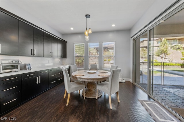 12665 Cooks Bay Ct, Las Vegas, NV 89141 - dining room with dark wood-style flooring, baseboards, a toaster, and recessed lighting