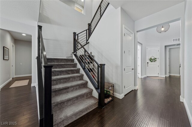 12665 Cooks Bay Ct, Las Vegas, NV 89141 - staircase with visible vents, baseboards, and wood finished floors