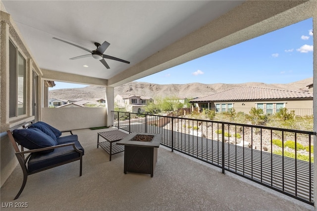 12665 Cooks Bay Ct, Las Vegas, NV 89141 - balcony featuring a mountain view, ceiling fan, an outdoor fire pit, and a residential view