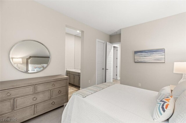 bedroom featuring ensuite bath