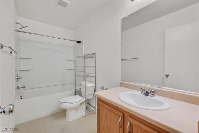 bathroom featuring toilet, vanity, bathtub / shower combination, and tile patterned flooring