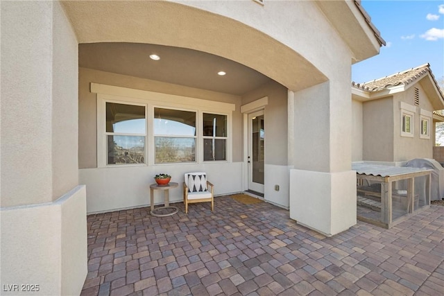 421 Foxhall Rd, Henderson, NV 89002 - view of exterior entry with a patio area and stucco siding