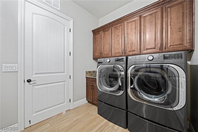 421 Foxhall Rd, Henderson, NV 89002 - laundry room featuring baseboards, visible vents, cabinet space, washer and dryer, and light wood finished floors
