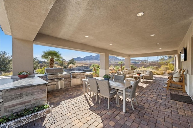421 Foxhall Rd, Henderson, NV 89002 - view of patio / terrace featuring an outdoor living space, outdoor dining area, area for grilling, and exterior kitchen